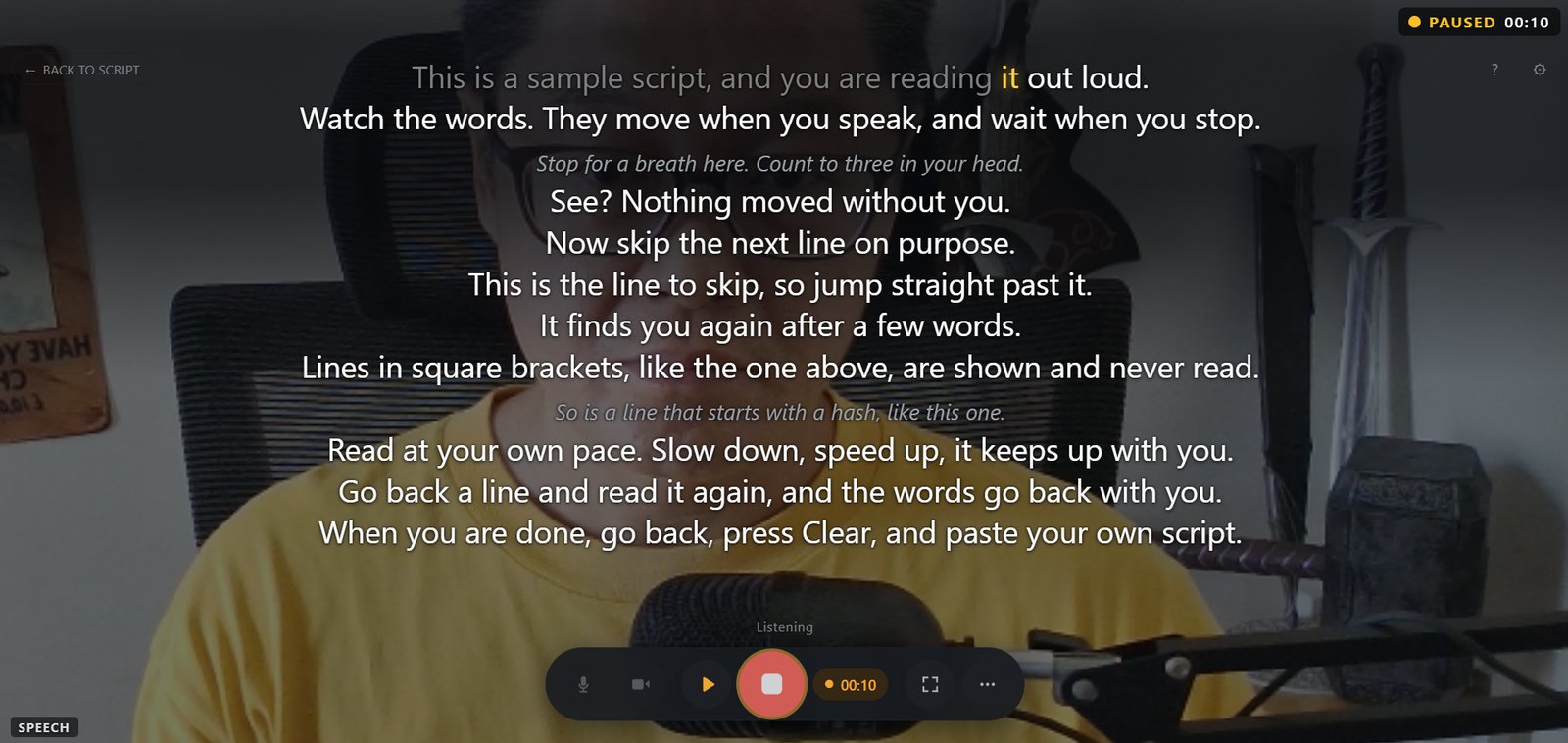 The cuekards prompter with a take paused: an amber PAUSED 00:10 badge in the top-right corner, the SPEECH chip bottom left, and the script holding on the last word read, with Listening shown above the control bar
